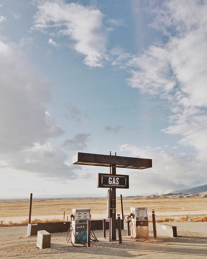 Image shows a gas station on a bright blue day. Image was taken on an iphone.