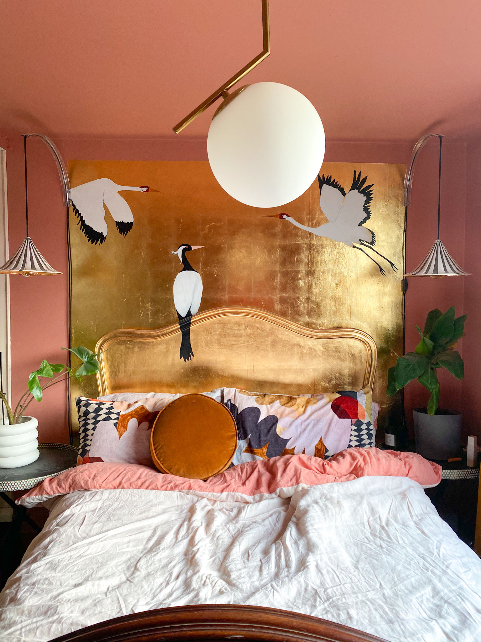 Gold leaf headboard mural with cranes