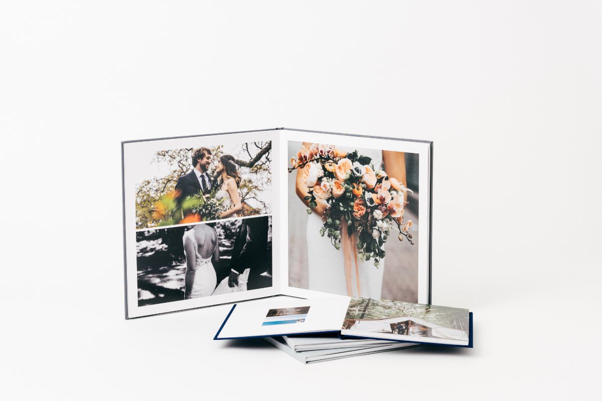 Wedding photo book ideas: double page layout with married couple and flowers