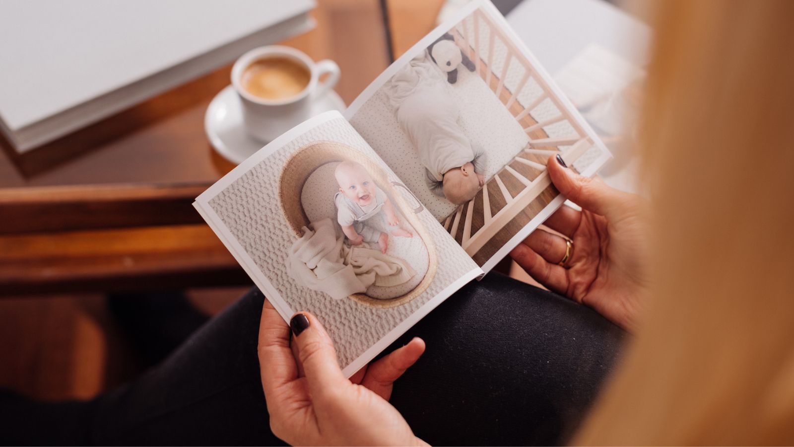 Mini photo book 140 × 140 mm softcover album in hand