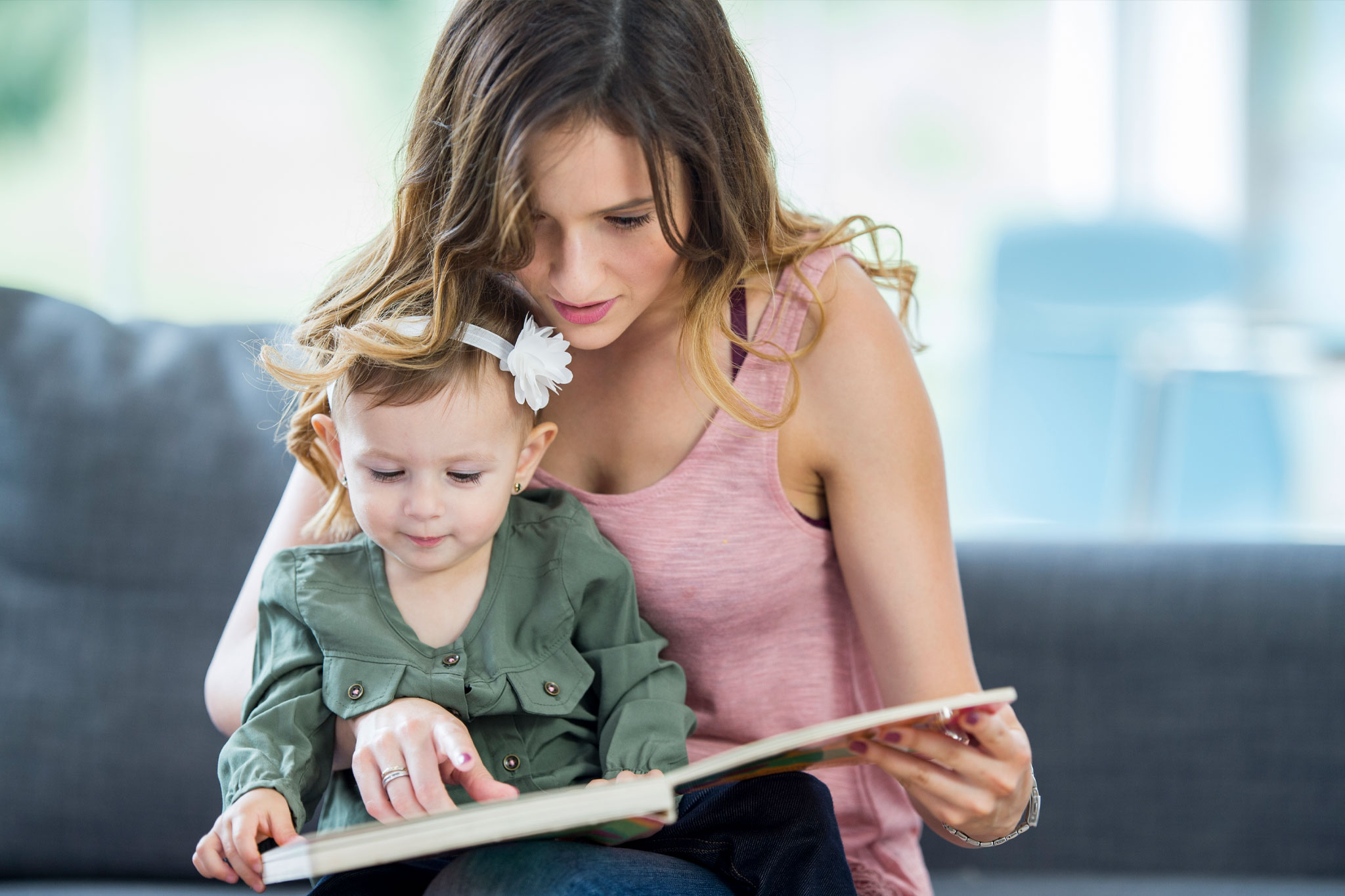 The Caption Photo Book with text being read by a mother and daughter