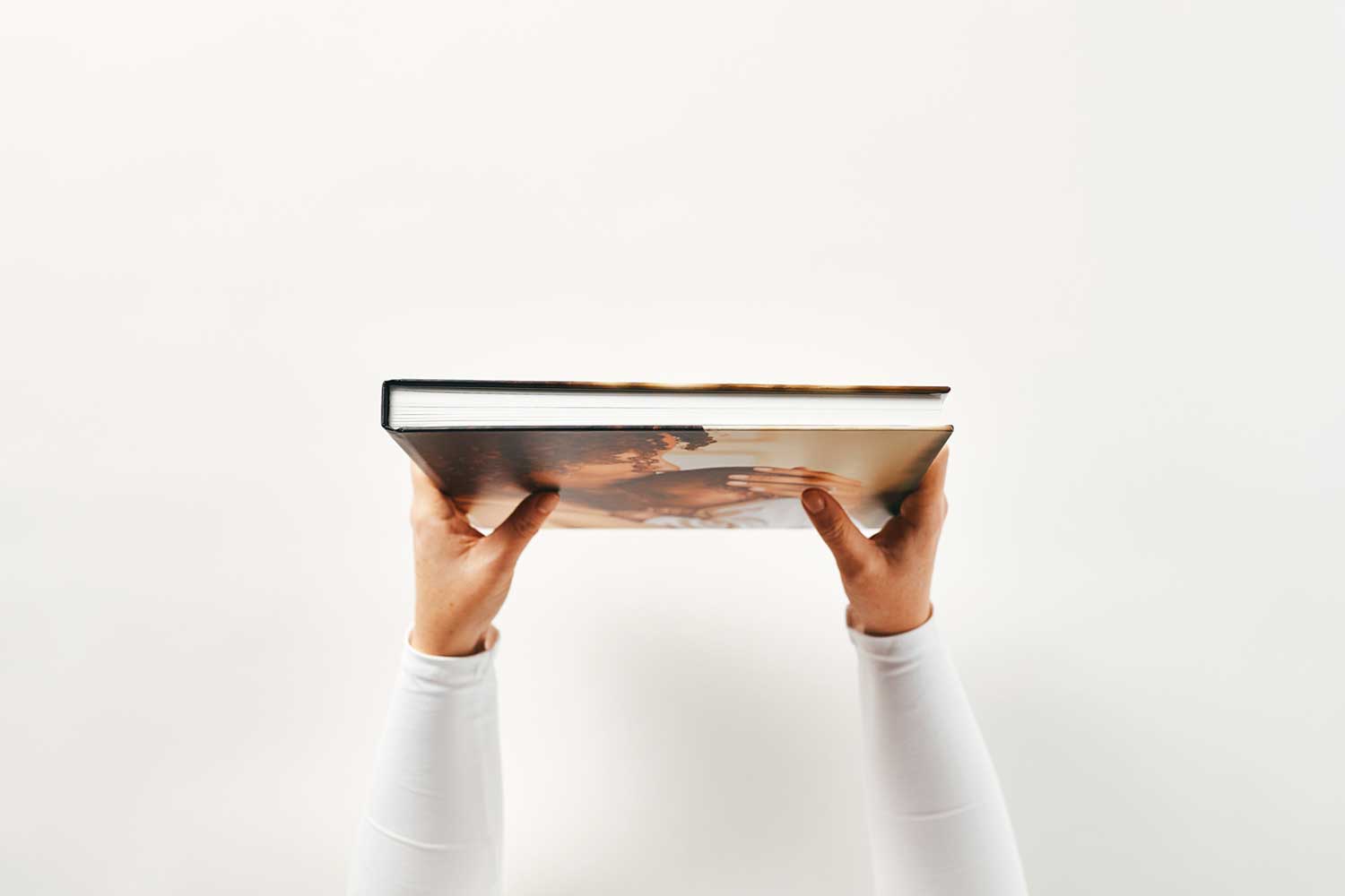 Hardcover photo book with photo-wrapped cover viewed from above