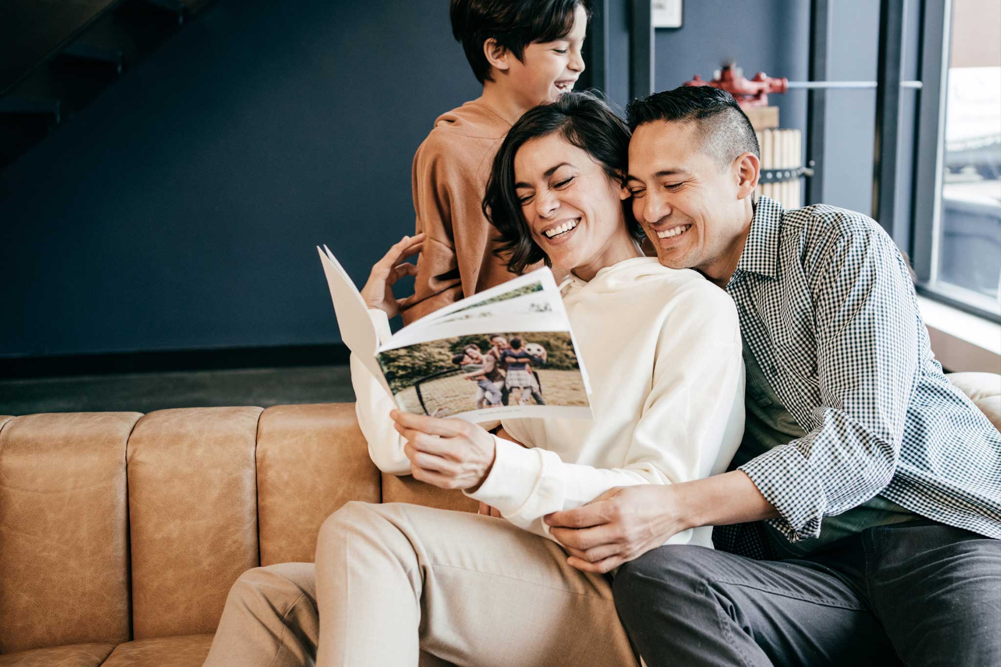 Happy Couple Reading Their Next Day Photo Book